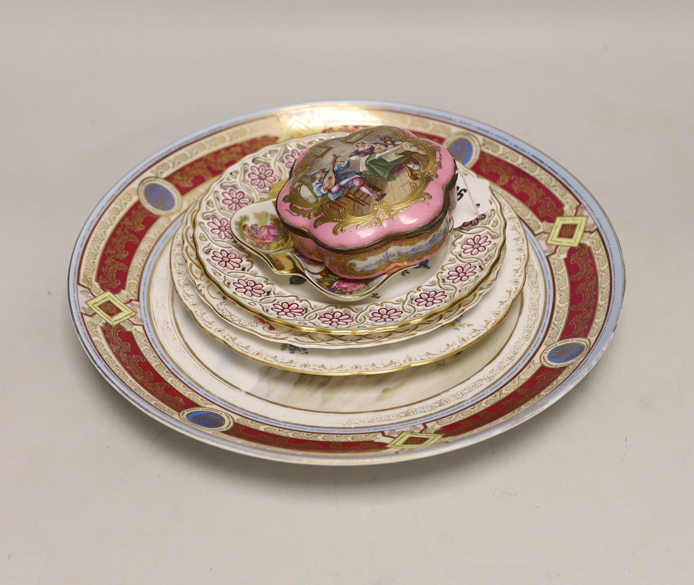 Six Continental porcelain items, including a Sevres style lidded box, a ‘Meissen’ plate with pierced rim, a Dresden plate, etc. largest 31.5cm